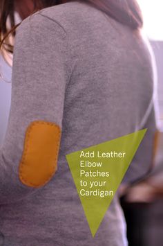 a woman wearing a gray sweater with an orange patch on her left arm and the words add leather elbow patches to your cardigan