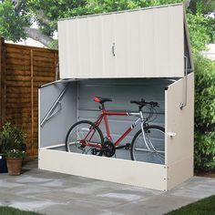 a bike is parked in the back of a storage shed