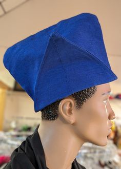 **Royal Blue Aso Oke Abeti-Aja "Akinrinola" Kufi Cap Hat by Dupsie's African Fashion** Elevate your formal or special occasion attire with the Royal Blue Aso Oke Abeti-Aja "Akinrinola" Kufi Cap Hat, exclusively designed by Dupsie's African Fashion. This exquisite African hat, steeped in rich cultural heritage, is more than just a fashion statement; it’s a celebration of Yoruba tradition and African fashion. **Historical Significance of the Abeti-Aja Hat:**The Abeti-Aja hat, known traditionally a Adjustable Blue Costume Hats With Curved Brim, Blue Adjustable Costume Hats With Short Brim, Adjustable Blue Bonnet Cap, Adjustable Blue Cap Costume Hats And Headpieces, Blue Adjustable Cap-style Costume Hats, Adjustable Blue Bonnet, Blue Flat Cap - One Size Fits Most, Blue Flat Cap One Size Fits Most, Blue One Size Flat Cap Baseball Cap