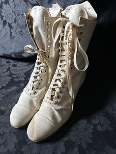 Original white/cream canvas Edwardian boots. Either new/old stock or barely worn. Some water staining, one original bootlace (short)  and one replacement bootlace. Manufacturer- Bedggood Manufacture of boots & shoes Premier (code 3E 575) Quite wearable, good solid condition. Measurements- 10 inches outside heel - toe, 2 inch heel, 3 inches widest width of sole, 9 inch height to top, 8 inch narrowest point at ankle (not inc lacing width), 9 inch leg. Eyelets 14 up (28 in total) These boots would 1800s Shoes, Edwardian Boots, Chunky Jewellery, Victorian Shoes, Victorian Boots, Fall Winter Trends, Wedding Boots, Old Fashion Dresses, Historical Dress