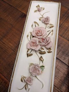 a white plate with pink flowers on it