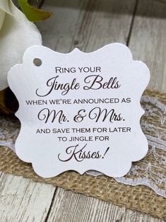 a wedding gift tag that says ring your single bells when we're announced as mr & mrs and save them for later to sing for kisses