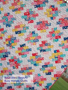 a quilt made with colorful squares on it