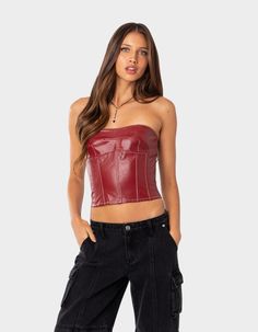 This Faux Leather Corset Is The Perfect Choice For A Night Out With The Girls. Its Lace Up Back Will Ensure You Feel Secure While You Dance All Night. Corset. Structured Stitch Design. Lace Up Back Closure. 100% Faux Leather. Item Care: Hand Wash. Model Wears Size S. Model Height Is 5'7. | Edikted Moss Faux Leather Lace Up Corset Top Red Corset Top, Lace Up Corset, Red Corset, Corset Style Tops, Woman Wine, Wine Top, Leather Corset, Corset Style, Women Corset