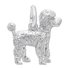 a silver dog charm on a white background