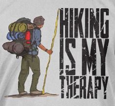 a man with a backpack is holding a stick in his hand and the words hiking is my therapy on it