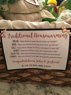 there is a sign in the basket that says it's traditional housewarming