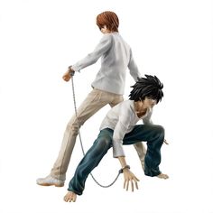 two anime figurines one is holding the other's hand as if they were pulling on chains