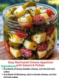 a glass jar filled with sliced cheese and pickles on top of a wooden table