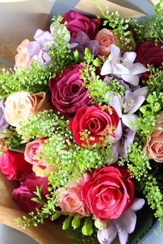 a bouquet of colorful flowers sitting on top of a table