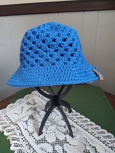 A granny stitch sun hat made from 100% cotton. Machine washable (gentle cycle, cold water); hang or lay flat to dry. Cotton Crochet Beach Hat With Short Brim, Beach Crochet Cotton Hat With Short Brim, Cotton Crochet Hat With Short Brim For Beach, Blue Cotton Sun Hat One Size Fits Most, Blue Cotton Sun Hat For Outdoor Use, Blue Cotton Sun Hat For Outdoor, Lightweight Crochet Hat With Curved Brim For Outdoor, Lightweight Brimmed Crochet Hat For Outdoor, Lightweight Curved Brim Crochet Hat For Outdoor