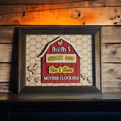 This super cute Mom's Chicken Coop framed sign will warm mama's heart.  We all know that Mom rules the roost so Rise & Shine Mother Cluckers!  The sign has an 8x10 repurposed frame stained with dark walnut to give that true country feel.  The backer has a light chicken wire style engrave.  The red barn, rooster, chicks and wording are layered for a 3D effect. Floral Chicken, Chicken Design, Chicken Coop Signs, Barn Decor, Farmhouse Art, Chicken Wire, Red Barn, Chicken Coop