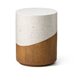 a white and wood stool with speckles on the top, sitting in front of a white background