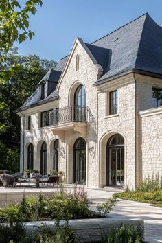 a large stone house with lots of windows