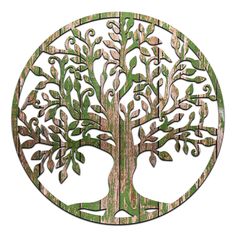 a metal tree with green leaves in a circular design on a white background is shown