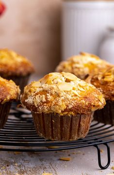 several muffins are cooling on a wire rack