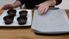 there are chocolates on the plate ready to be cut into bite size pieces and put in bowls