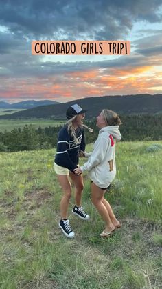 two girls standing on top of a grass covered field with the words colorado girls trip