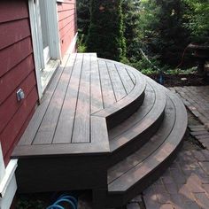 a wooden deck with steps leading up to it