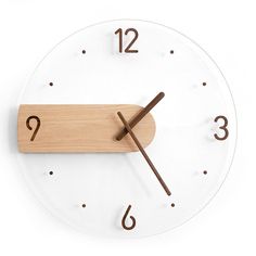 a white clock with brown numbers on it