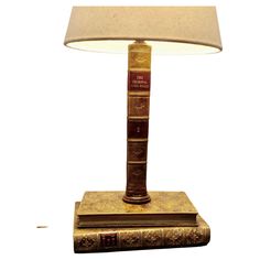 a lamp that is on top of some books