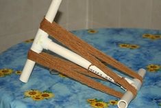 a close up of a table with a blue cloth on it and a wooden stick sticking out of the top