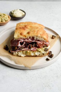 a sandwich sitting on top of a white plate