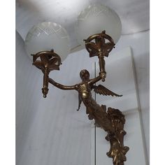 an antique chandelier hanging from the ceiling