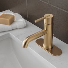 a bathroom sink with a soap dispenser next to it