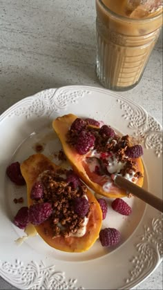 two desserts on a white plate next to a drink