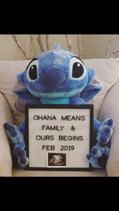 a stuffed animal sitting on top of a chair holding a sign that says obama means family & ourss begins feb 19