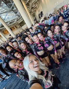 a group of cheerleaders posing for a photo