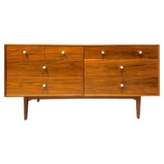 a large wooden dresser with four drawers