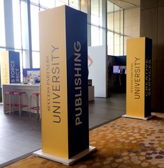 an exhibit area with two blue and yellow banners