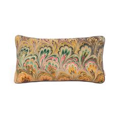 a decorative pillow with multicolored swirls on the front and back, sitting on a white surface