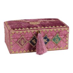 a pink and gold box with a tasseled handle