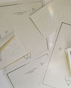 four pieces of paper with hearts on them and some envelopes next to each other