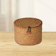 an empty basket sitting on top of a wooden table