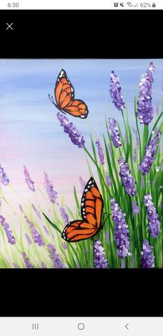 two orange butterflies flying over purple flowers and green grass with blue sky in the background