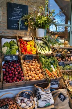 an assortment of fruits and vegetables on display