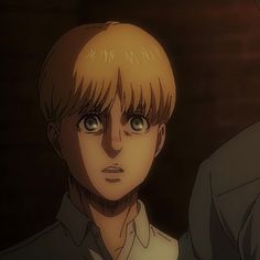 an anime character with blonde hair and blue eyes looking at the camera while another man looks on