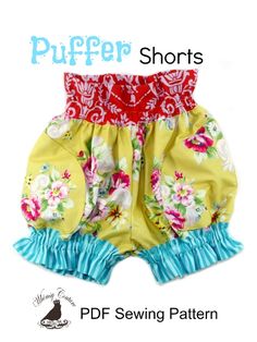 a pair of shorts with flowers and blue ruffles on the bottom is shown