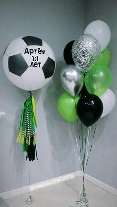 balloons and streamers in the shape of soccer balls