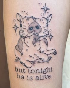 a tattoo with an image of a cat and the words, but tonight he is alive