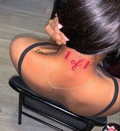 the back of a woman's neck with an inscription on it that says love