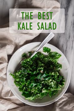 the best kale salad is in a white bowl