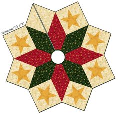 a quilted star with red, green and yellow stars on the center is shown