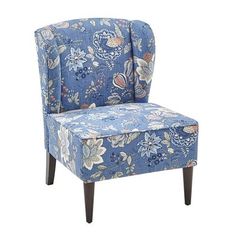 an upholstered chair with blue and white flowers