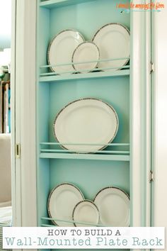 a blue china cabinet with plates on it and the words how to build a wall mounted plate rack