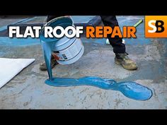 a man is painting the floor with blue paint and a white cone next to it